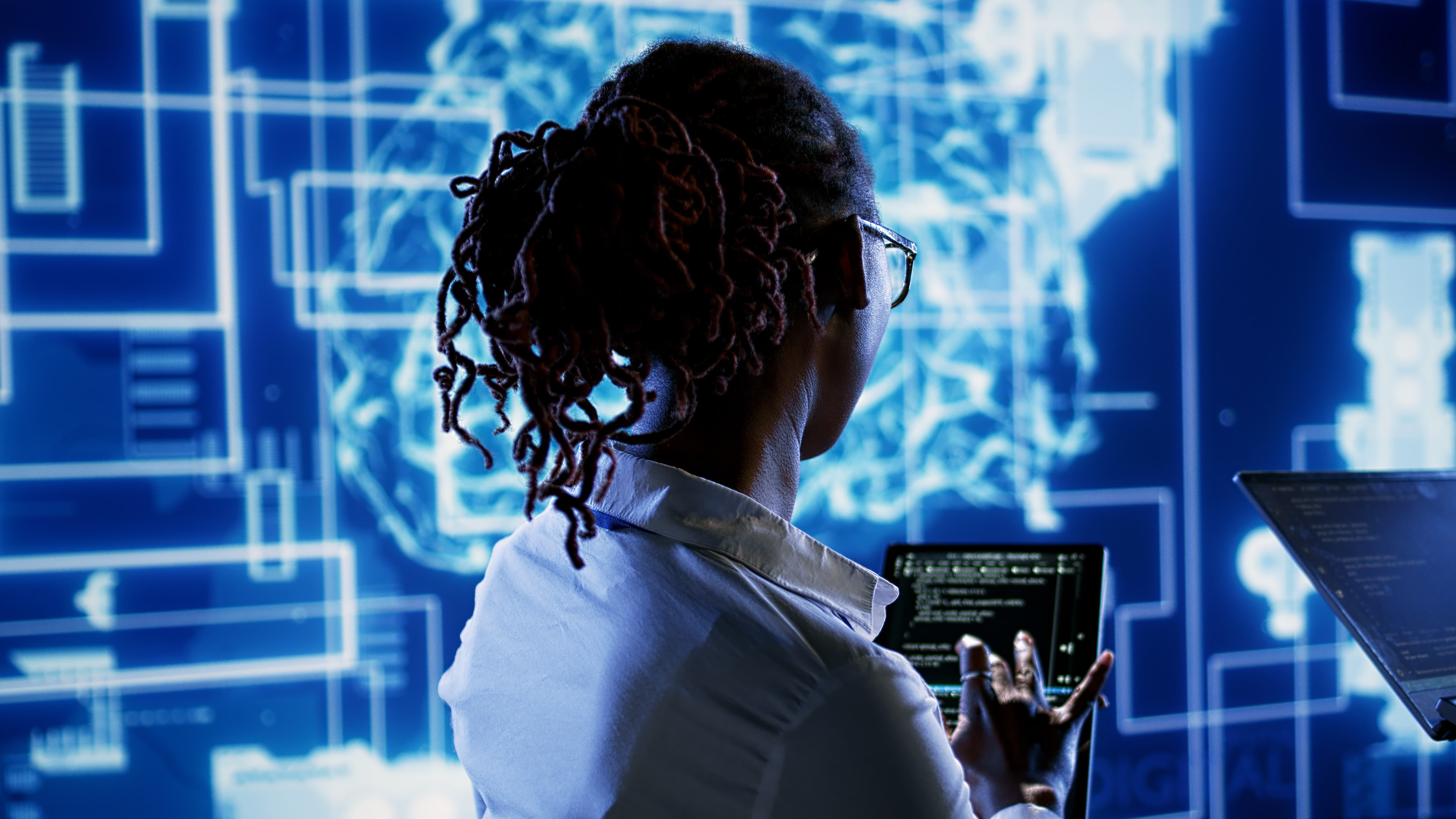 Consultants working on AI systems